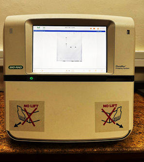 A machine with a screen and a button

AI-generated content may be incorrect.