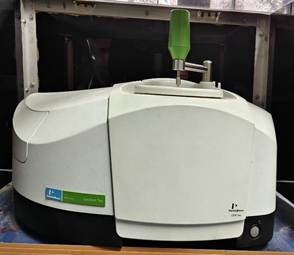 A white machine with a green handle

AI-generated content may be incorrect.
