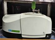 A white machine with a green handle

AI-generated content may be incorrect.